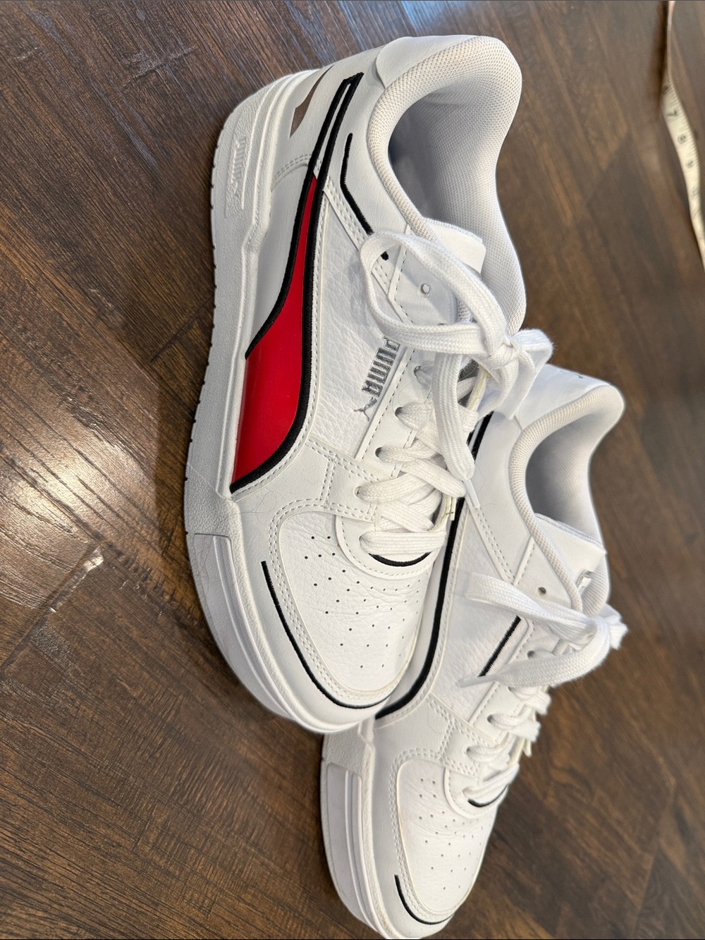 Puma Kids White Sneakers with Red and Black Accents